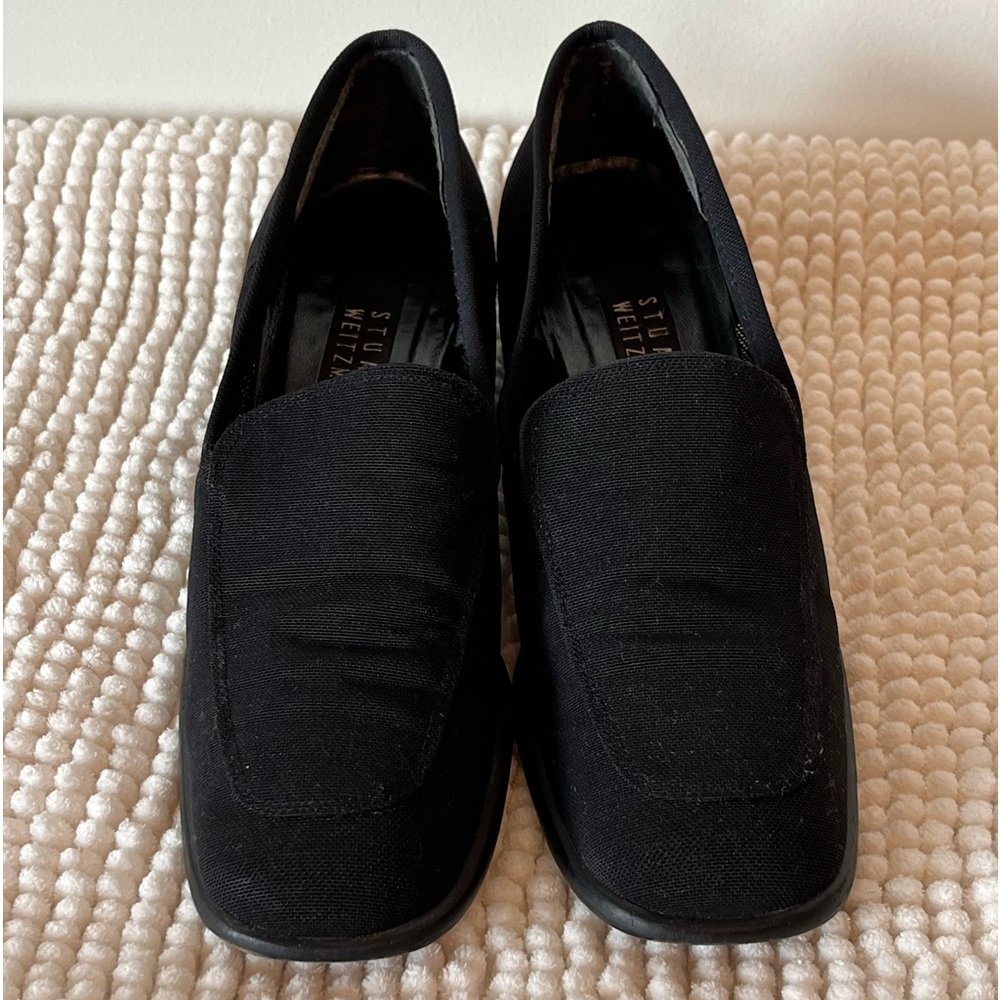 Stuart Weizmann black loafers.